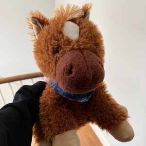 large brown pony plushie with navy necktie kerchief